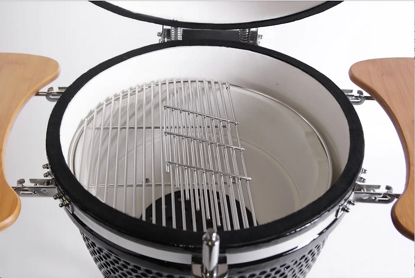 Close-up of a kamado with a metallic grille on a white background