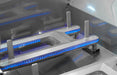 Close-up of a metallic grill with blue LED lighting inside an oven.