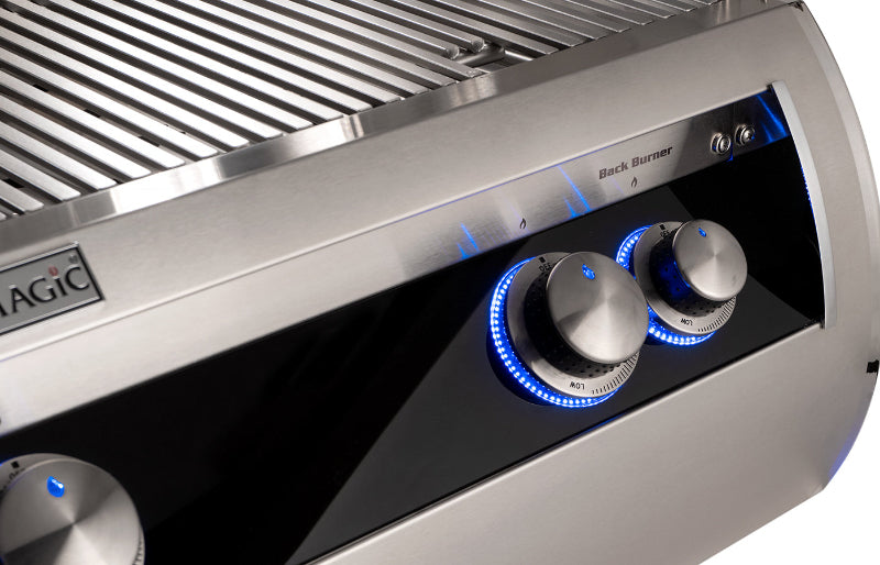 Stainless steel grill with control knobs on a white background