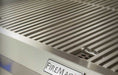 Stainless steel grill with 'Fire Magic' branding on a blurred background