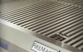Stainless steel grill with 'Fire Magic' branding on a blurred background