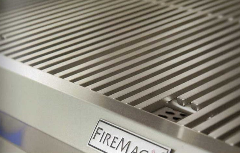 Stainless steel grill with 'Fire Magic' branding on a blurred background