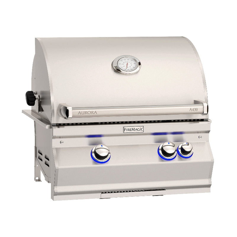 Stainless steel grill with 'Aurora' and 'FireMagic' branding on a white background
