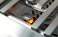 Close-up of a gas stove burner with visible flame