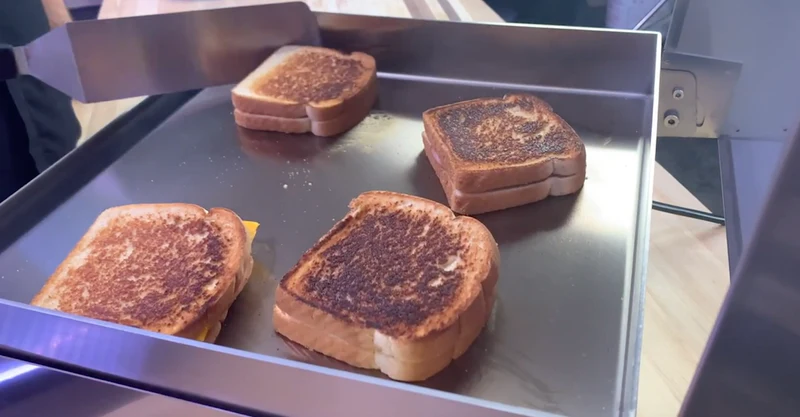 Grilled sandwiches on a metal griddle