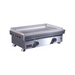 Stainless steel griddle on a white background