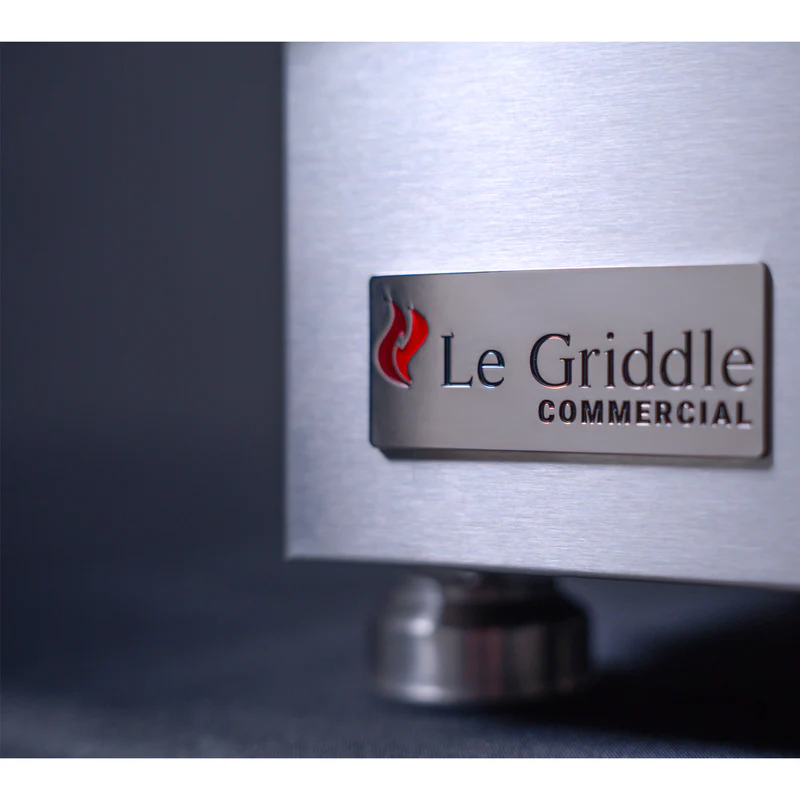 Metallic surface with 'Le Griddle Commercial' logo