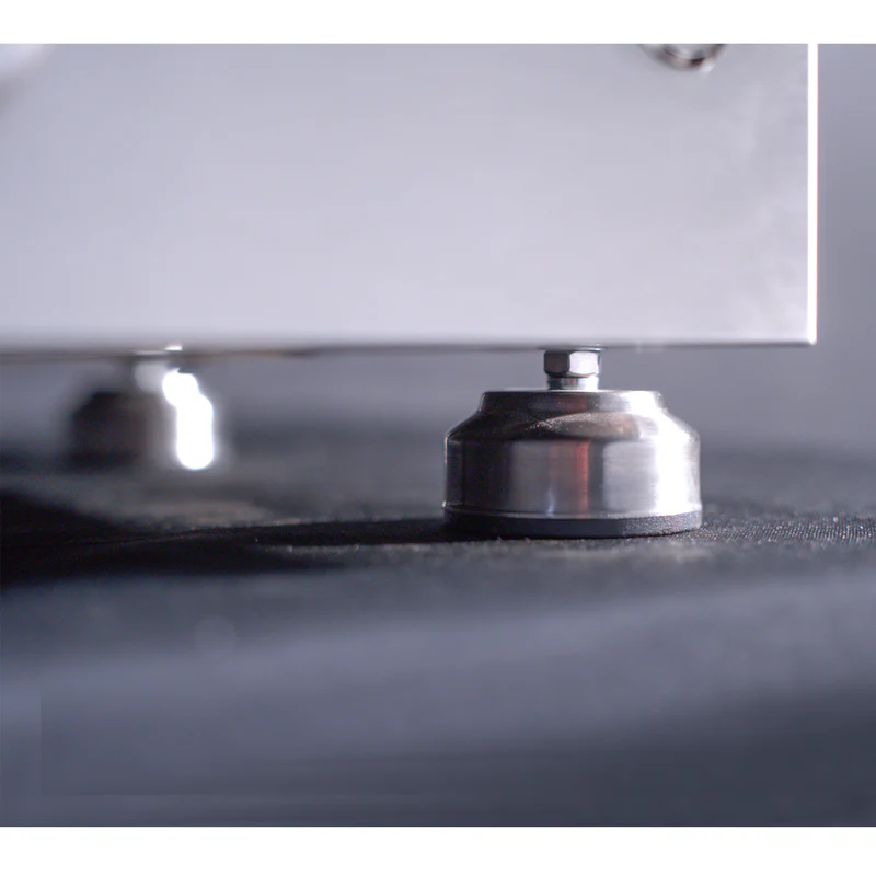 Close-up of a metal object on a reflective surface