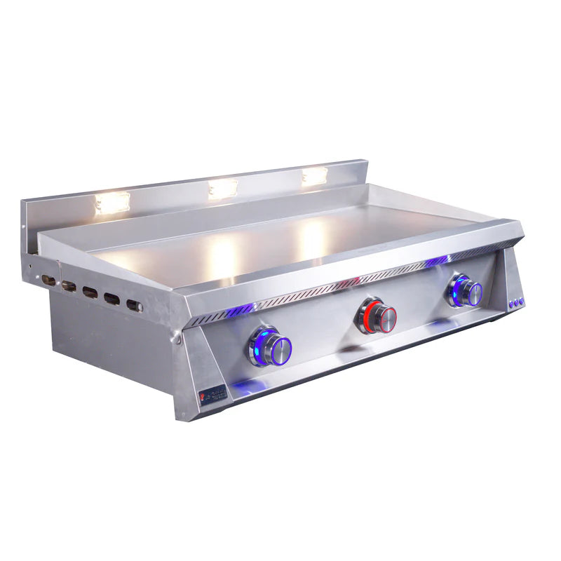 Stainless steel griddle with four control knobs on a white background