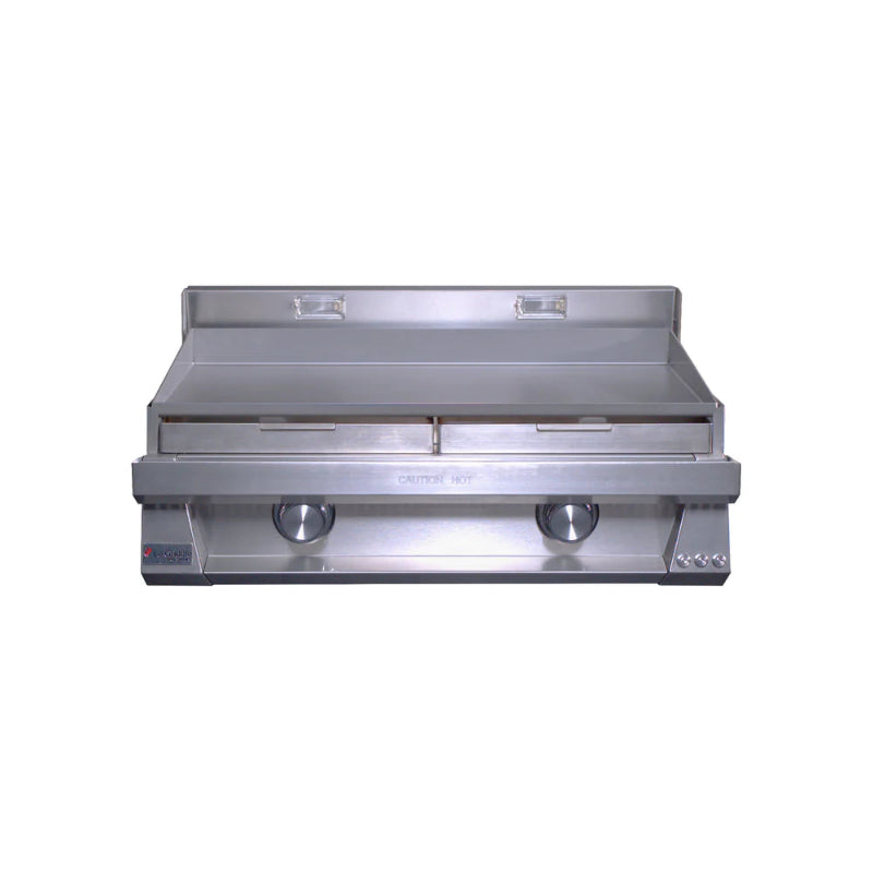 Stainless steel griddle on a white background