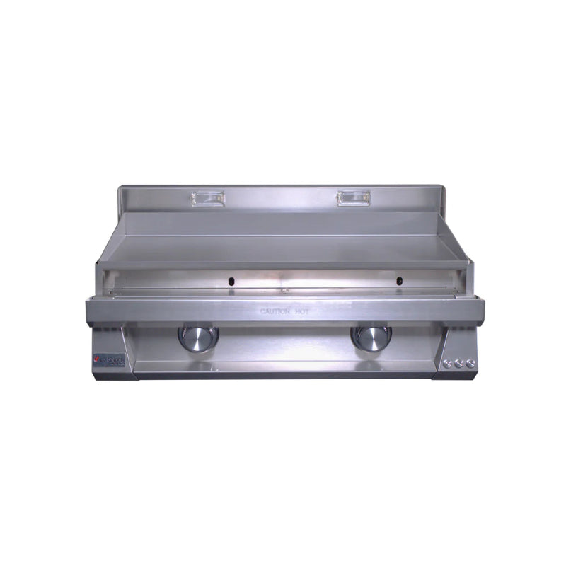 Stainless steel griddle on a white background
